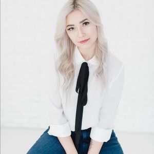 White shirt with ruffle collar and black string